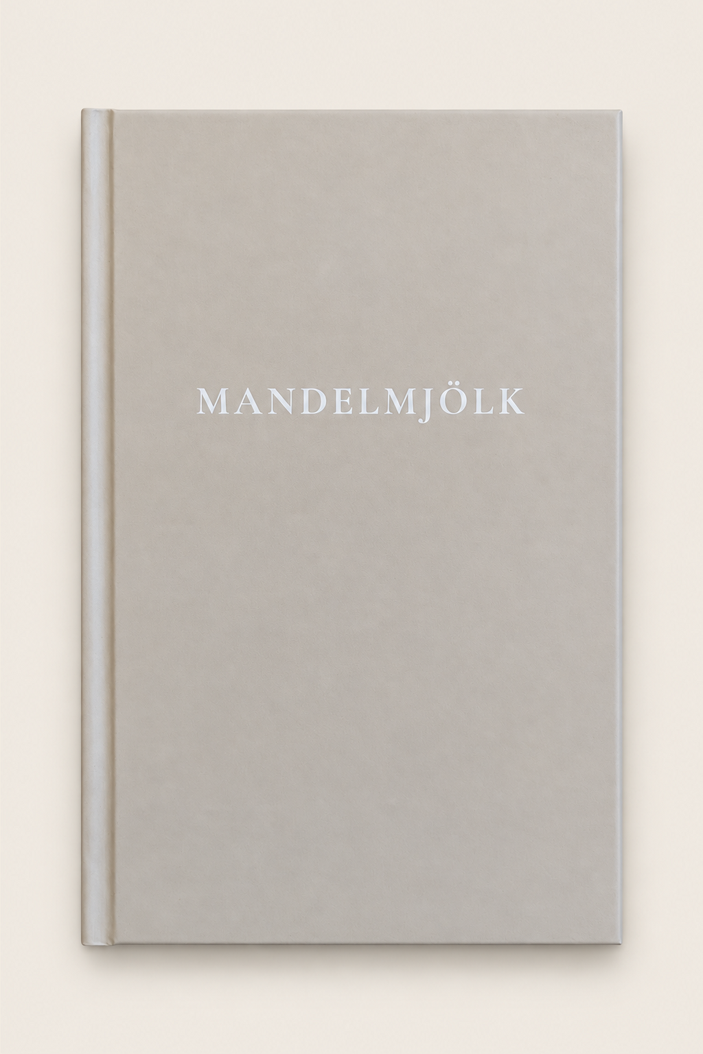 Beige Mandelmjölk anteckningsbok mot beige bakgrund
